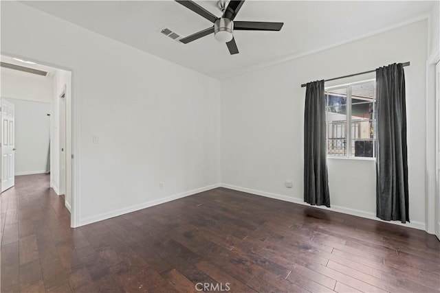 spare room with ceiling fan and dark hardwood / wood-style floors