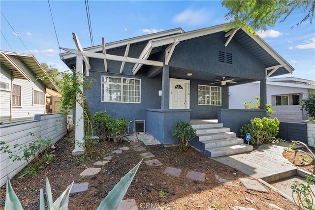 view of front of house with ceiling fan