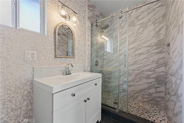 bathroom with an enclosed shower and vanity