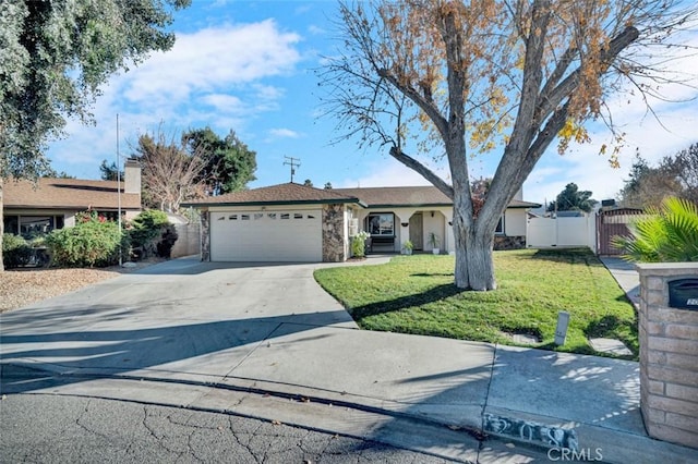 single story home featuring a front lawn and a garage