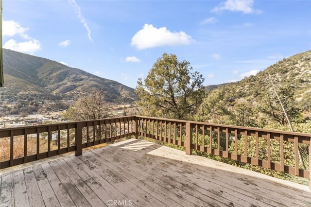 wooden terrace with a mountain view