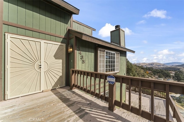 wooden deck featuring a mountain view