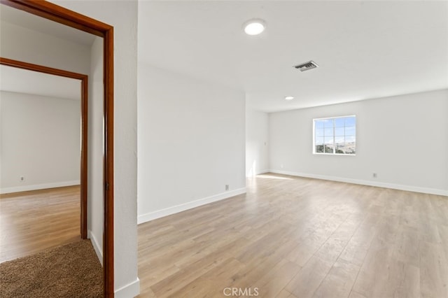 unfurnished room featuring light hardwood / wood-style flooring