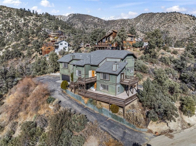 birds eye view of property with a mountain view