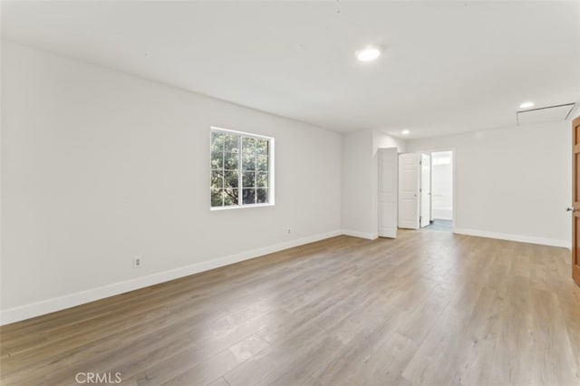 unfurnished room featuring light hardwood / wood-style floors