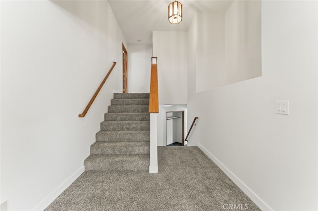 staircase with carpet