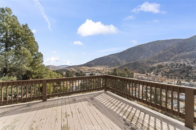 wooden deck featuring a mountain view