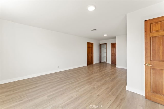 empty room with light wood-type flooring