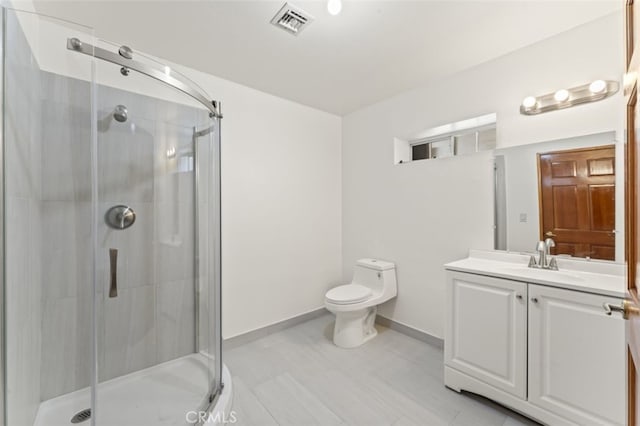 bathroom with toilet, vanity, tile patterned floors, and a shower with door