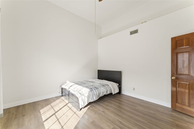 bedroom with hardwood / wood-style floors