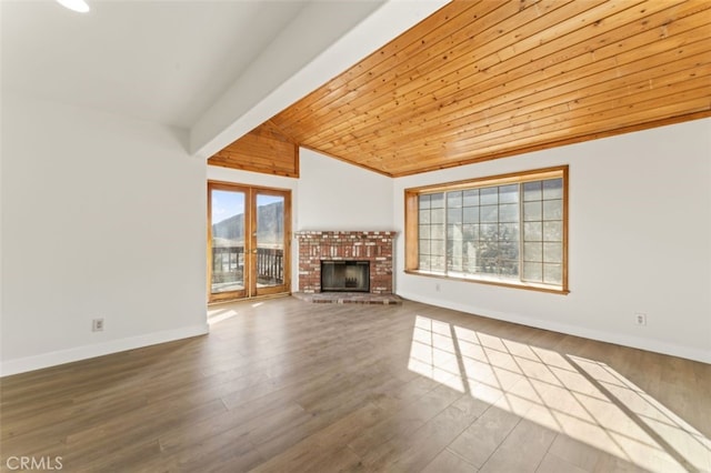 unfurnished living room with wood ceiling, wood-type flooring, french doors, vaulted ceiling, and a brick fireplace