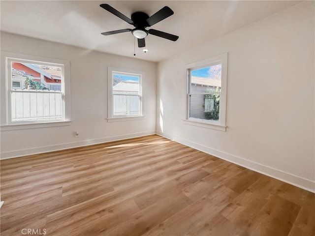 unfurnished room featuring ceiling fan and light hardwood / wood-style floors