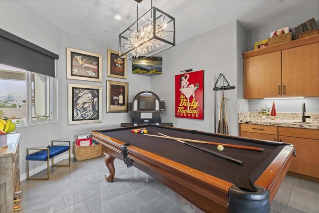 rec room with sink, light tile patterned floors, a notable chandelier, and pool table