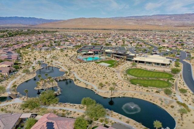 birds eye view of property featuring a water and mountain view