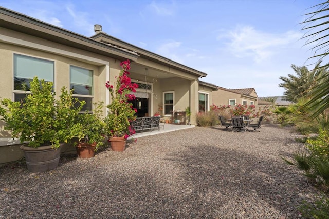 rear view of property with a patio area