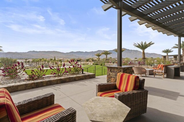 view of patio / terrace with a pergola, outdoor lounge area, and a mountain view