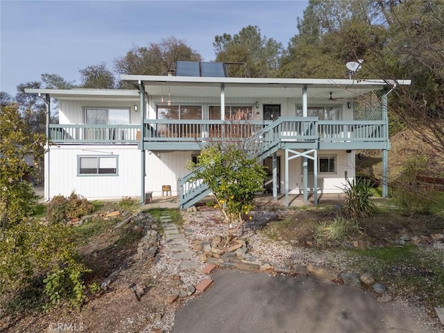 view of front of property featuring ceiling fan and a porch