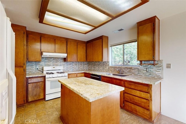 kitchen with white appliances, tasteful backsplash, a kitchen island, and sink