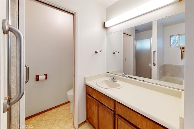 bathroom with vanity and toilet