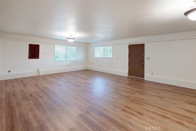 spare room with light wood-type flooring