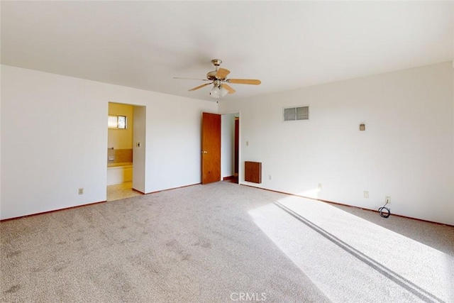 unfurnished room with ceiling fan and carpet floors