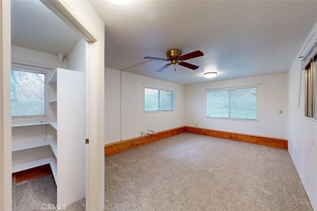 carpeted empty room with ceiling fan