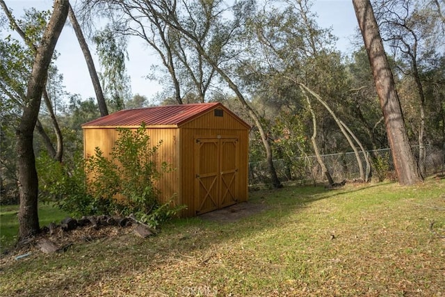 view of outbuilding with a lawn