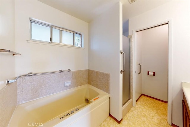 bathroom with shower with separate bathtub and vanity