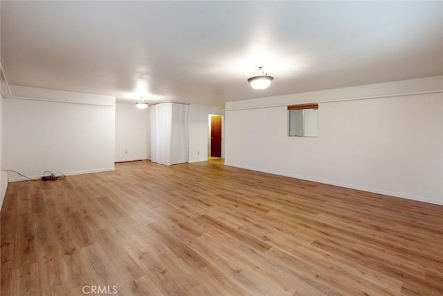 basement with light wood-type flooring