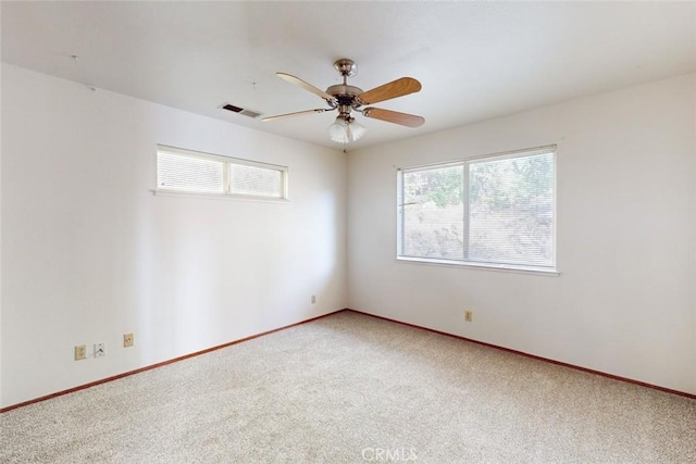 carpeted empty room with ceiling fan