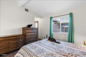 bedroom featuring lofted ceiling with beams and dark hardwood / wood-style floors