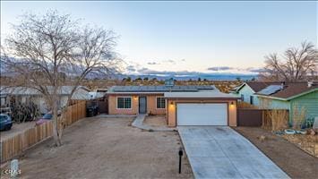 single story home featuring a garage