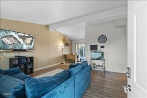 living room featuring vaulted ceiling with beams and hardwood / wood-style floors