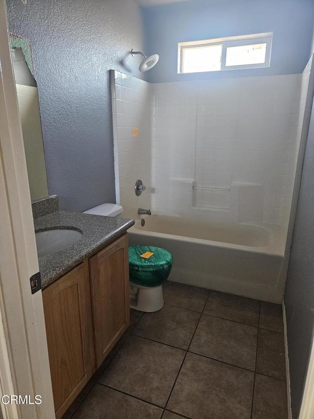 full bathroom with tile patterned floors, vanity, toilet, and shower / tub combination