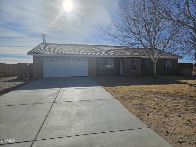 ranch-style house featuring a garage