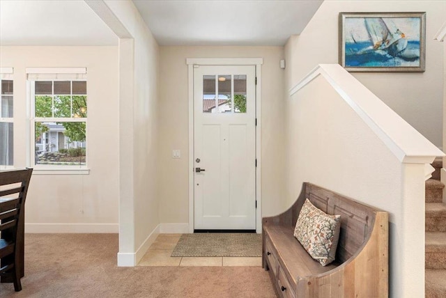 view of carpeted foyer