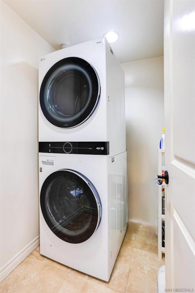 washroom with stacked washer and dryer