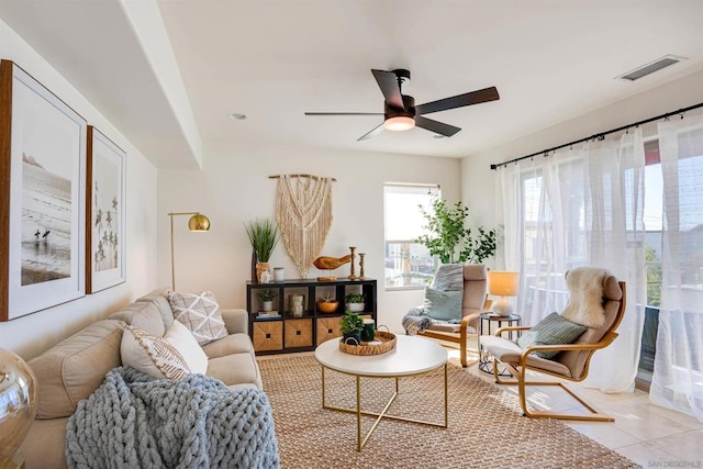 sitting room with ceiling fan and light tile patterned floors