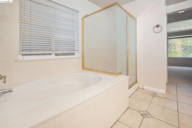 bathroom featuring shower with separate bathtub and tile patterned floors