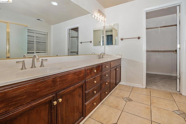 bathroom with vanity and tile patterned flooring