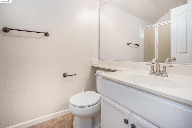 bathroom featuring toilet, tile patterned flooring, vanity, vaulted ceiling, and a shower with door