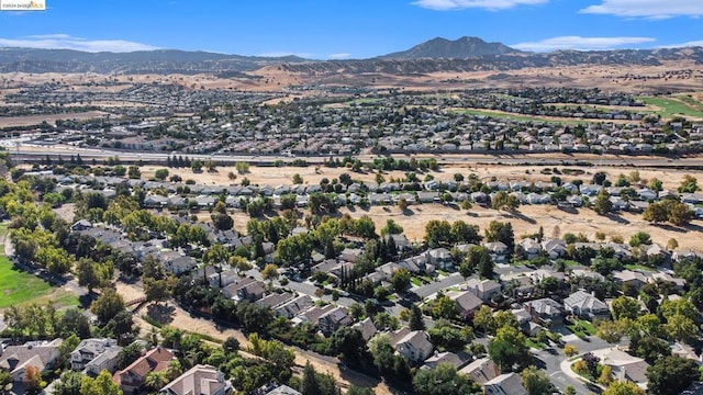 birds eye view of property with a mountain view