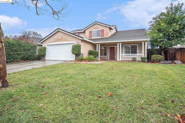 view of front of property featuring a front yard, a porch, and a garage