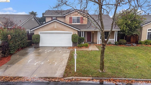 view of front property featuring a porch, a garage, and a front lawn