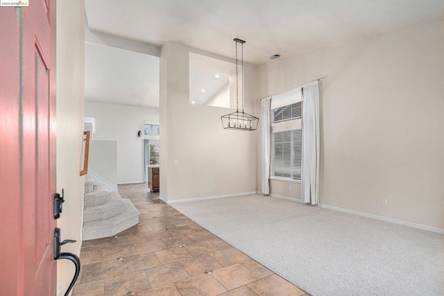 view of carpeted foyer