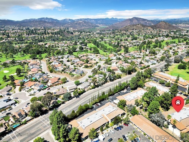 birds eye view of property featuring a mountain view