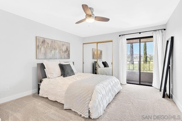 bedroom featuring access to exterior, light carpet, a closet, and ceiling fan