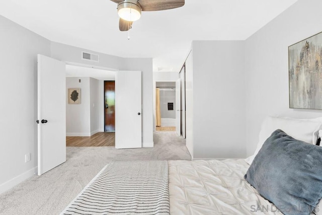 carpeted bedroom with ceiling fan