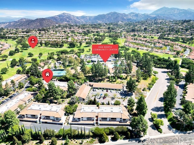 birds eye view of property featuring a mountain view