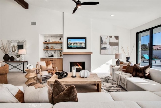 living room with vaulted ceiling with beams and ceiling fan